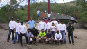 Voluntteer footbridge builders pose with with local residents