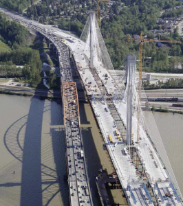 Aerial view of the Port Mann Bridge with cars on it