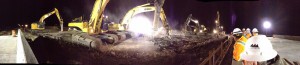 Manderfield Bridge panorama night photo showing construction workers watching massive drills pound the ground.