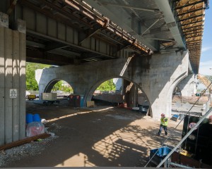 Crews are essentailly demolishing the bridge from underneath and rebuilding it from below.