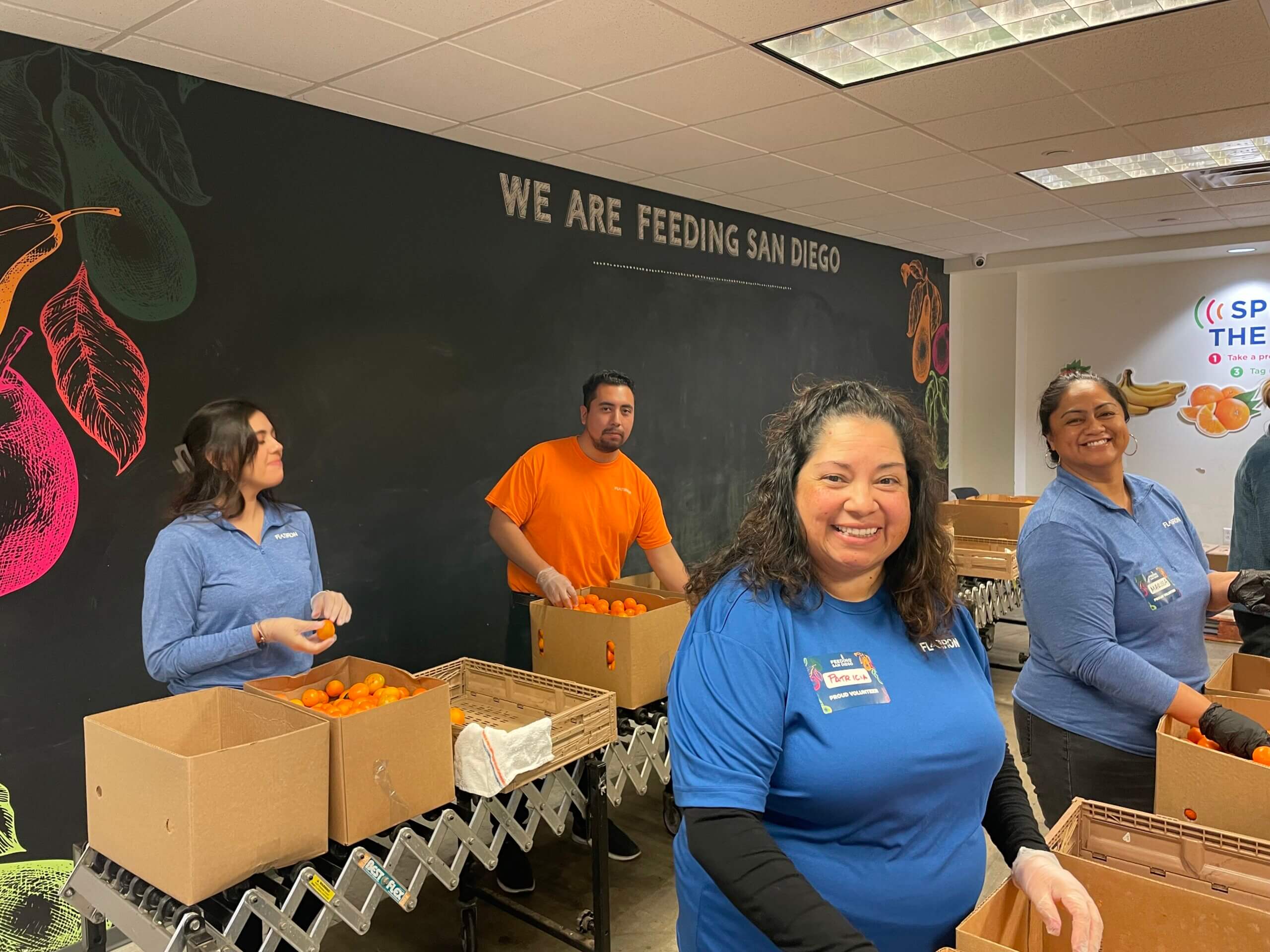 Flatiron employees volunteering at Feeding America