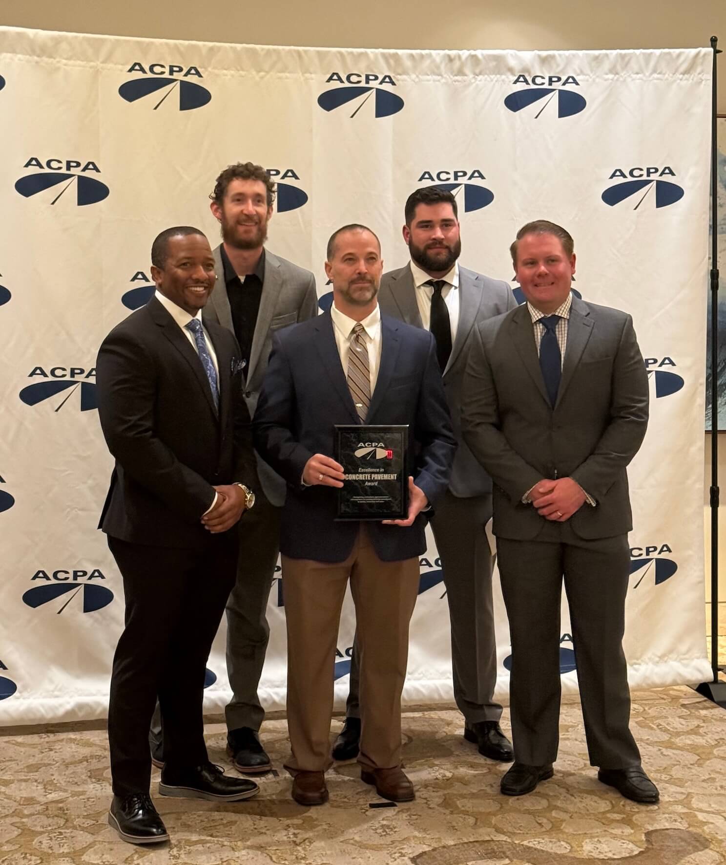 Flatiron employees accepting the American Concrete Pavement Association Commercial Service Airports - “Gold”